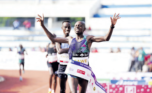 Men's overall winner Kenya's Sebastian Sawe at the finish line at the TCS World 10K 2023