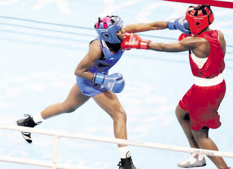 Elizabeth Akinyi of Kenya in action with Alcinda De Santos of Mozambique in a past bout