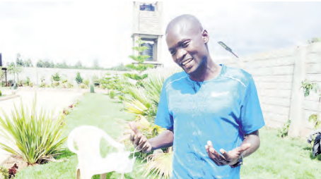 Abel Kirui in a light moment during the interview at his home in Eldoret
