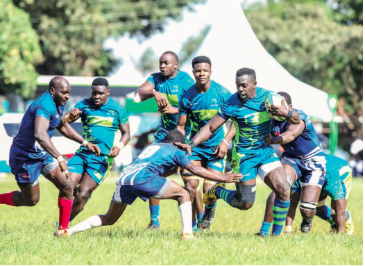 KCB's Felix Ojow brushes off a Strathmore Leos' defender during a past match
