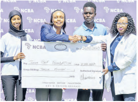 NCBA's Nelly Wainaina presents a dummy cheque to JGF President, flanked by junior golfers./HANDOUT