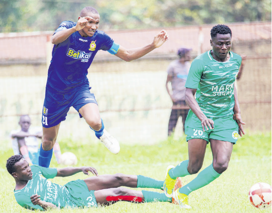 Police FC Clinton Kinanga battles for the ball with Mara Sugar's central defender Victor Mulama /POLICE FC