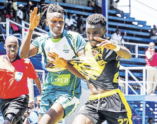 KCB’s Francis Kahiro (L) battles for the ball with Rajab Omar of Murang’a Sea