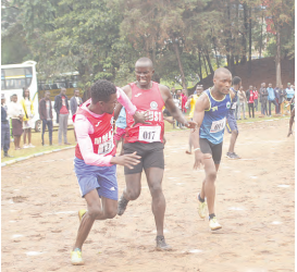 Athletes exchange batons in the men’s 4x100m relay at Kisii University on Sunday /ANGWENYI GICHANA