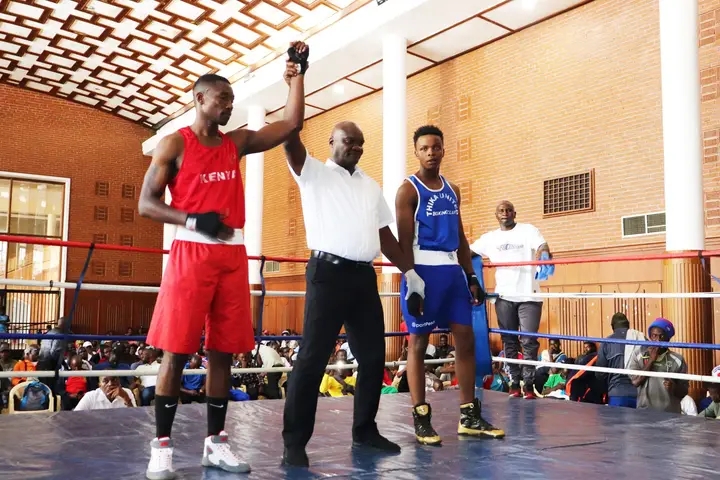 Bonface Mugunde of Kenya Piluce is declared winner of his bout after defeating Chris Musyoki during the Kenya Open Boxing championship at Charter Hall, Nairobi/HANDOUT
