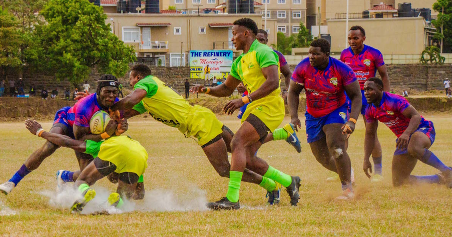 Dennis Abukuse (L) of Oilers is challenged by Kabras Sugar opponents during a Kenya Cup match in Nakuru/ HANDOUT