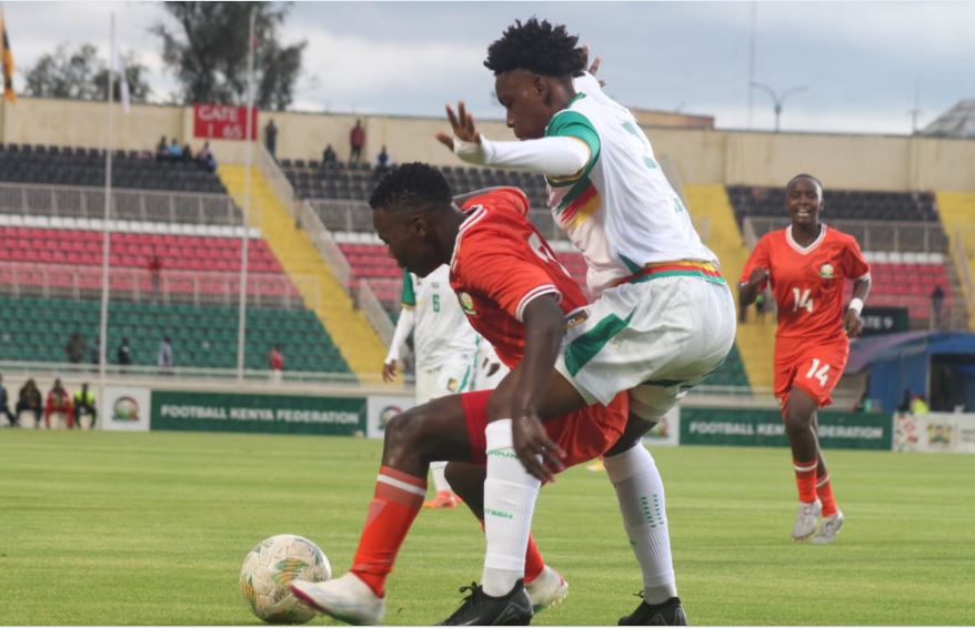 Junior Starlets' Edinah Nasipwondi shields the ball from Cameroon’s Aghogue Crystal/ CHARLENE MALWA