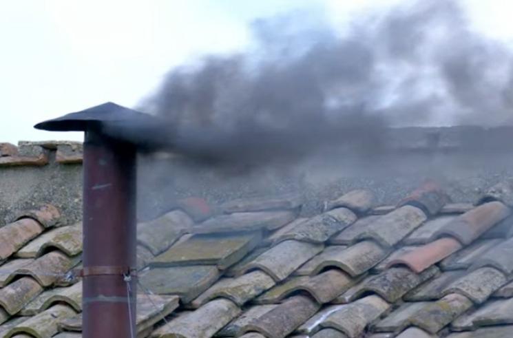 No Pope yet as black smoke billows from chimney