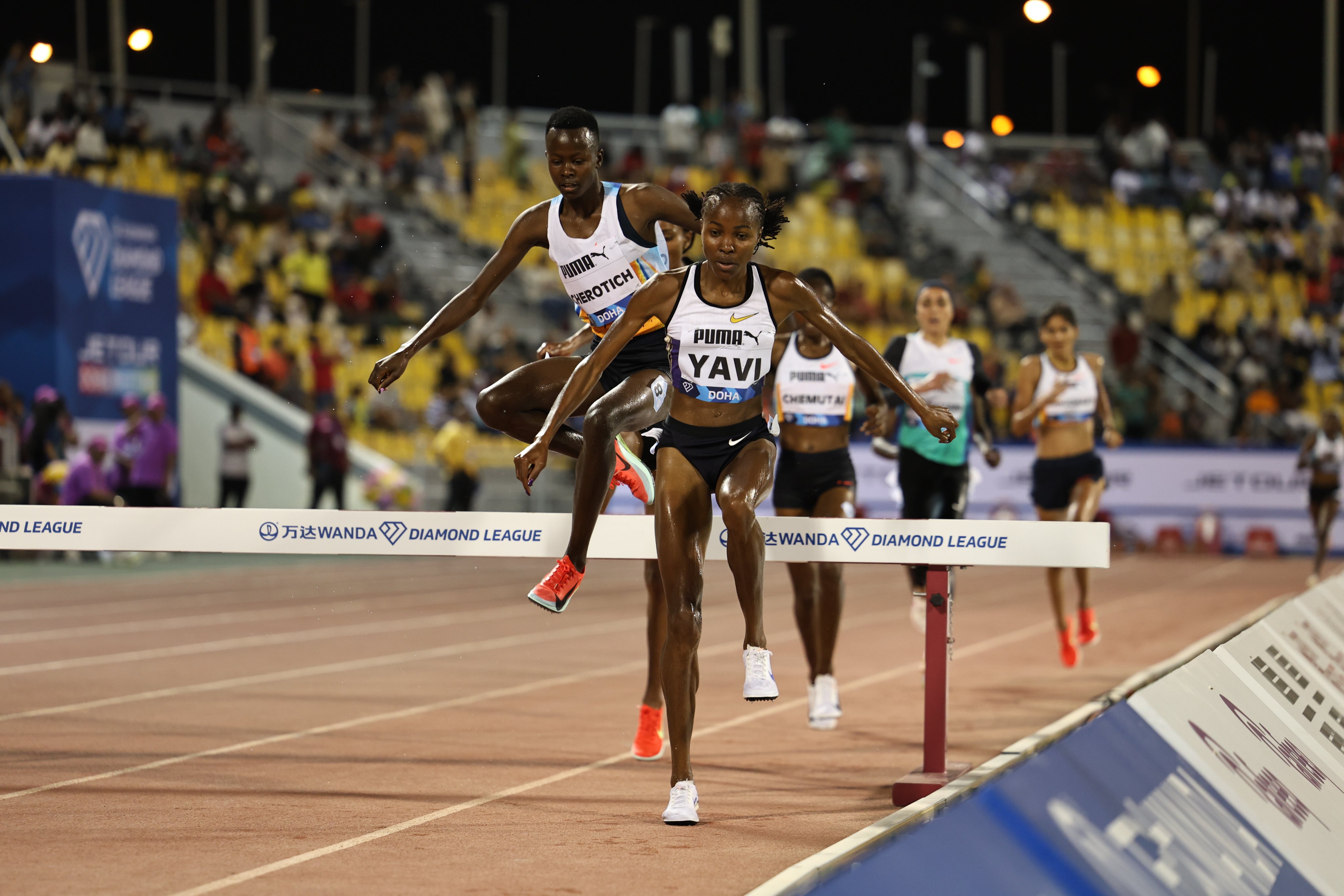 Faith Cherotich (L) and Winfred Yavi clear the barrier at the Doha Diamond League/ HANDOUT