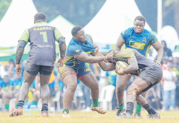 KCB’s Wilhite Mususi (2nd R) challenges Kabras Sugar’s George Nyambua during a Kenya Cup encounter at the ASK Showground, Kakamega, on March 8 /HANDOUT