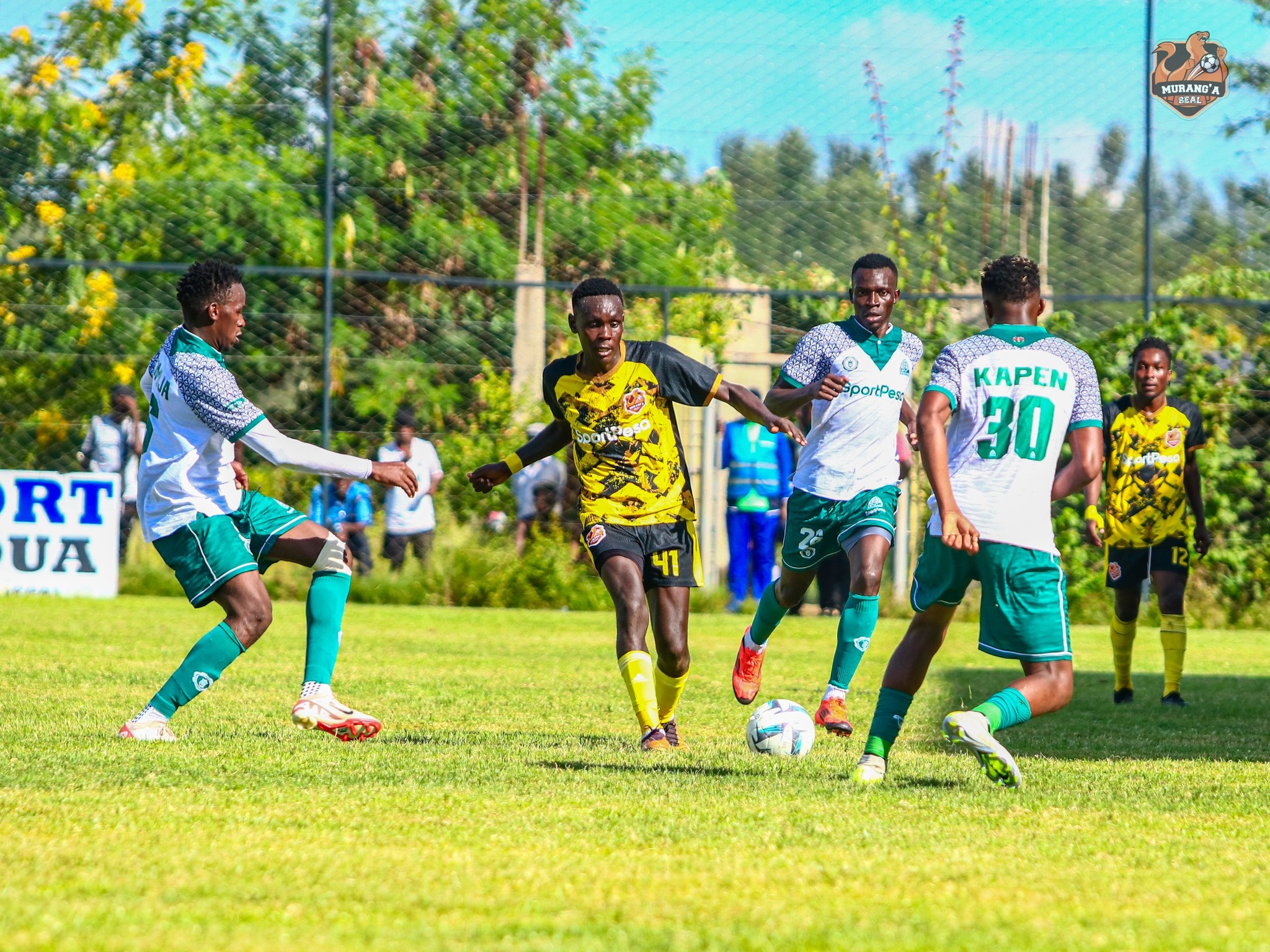 Murang'a Seal Joe Waithera tries to dribble past Gor Mahia players/ HANDOUT