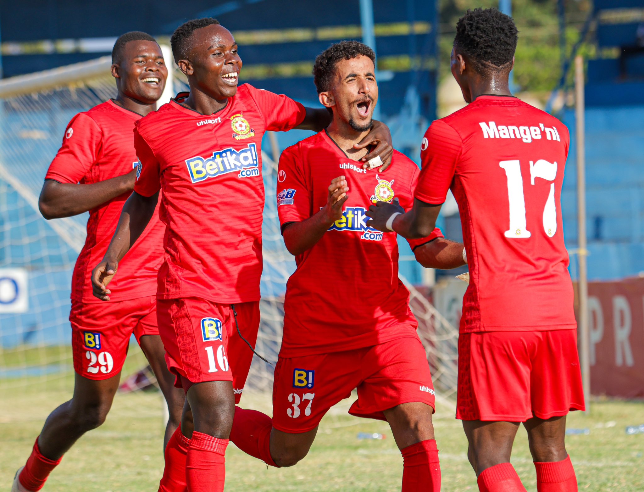 Police players David Simiyu (29), Daniel Msamali (16), Bajaber Mohamed (37) and Alvin Mange'ni (17) celebrate in a past match /HANDOUT
