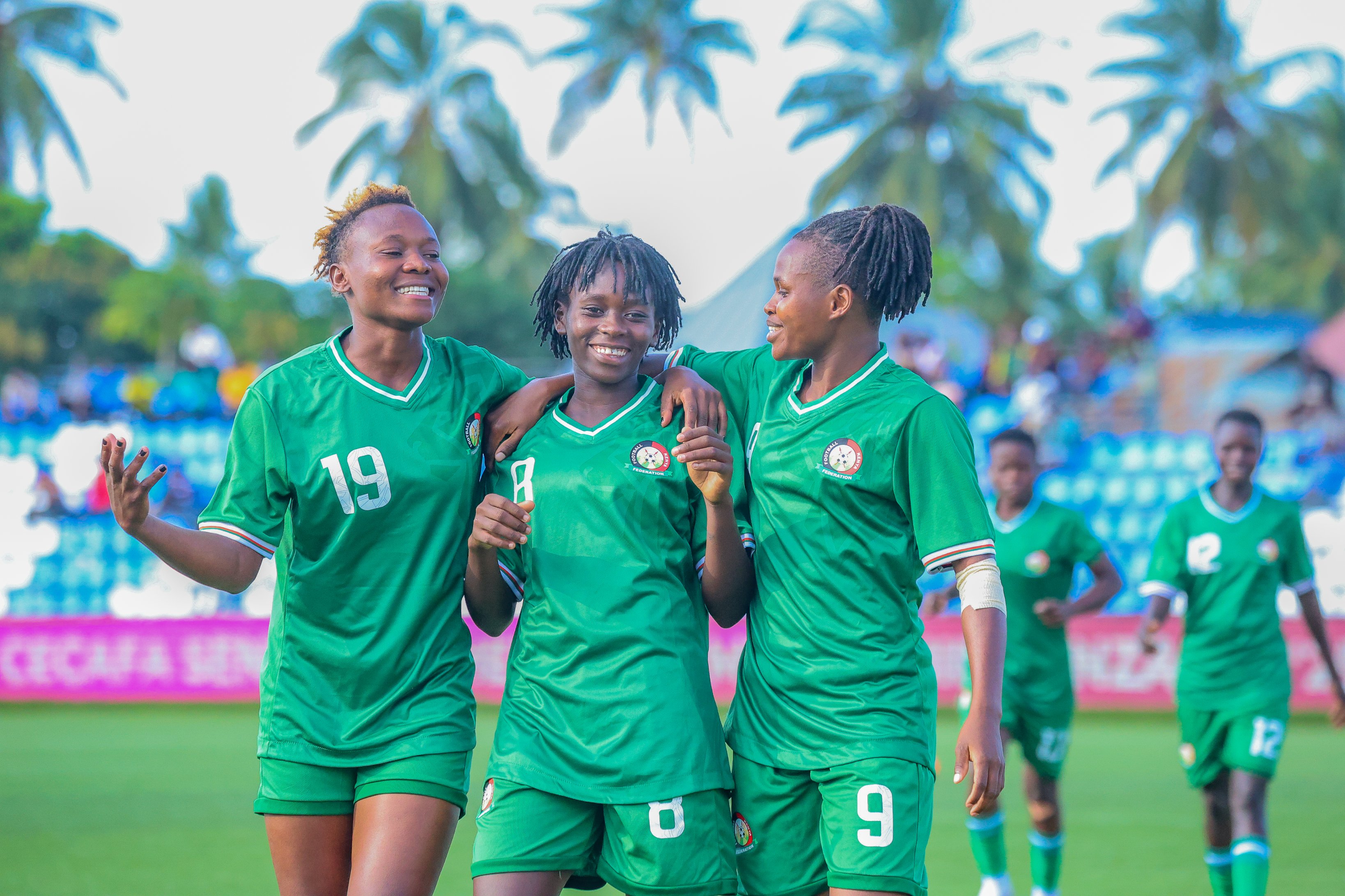 Harambee Starlets Violet Nanjala, Faith Mboya and Tumaini Waliaula celebrate after their win against South Sudan/ HANDOUT