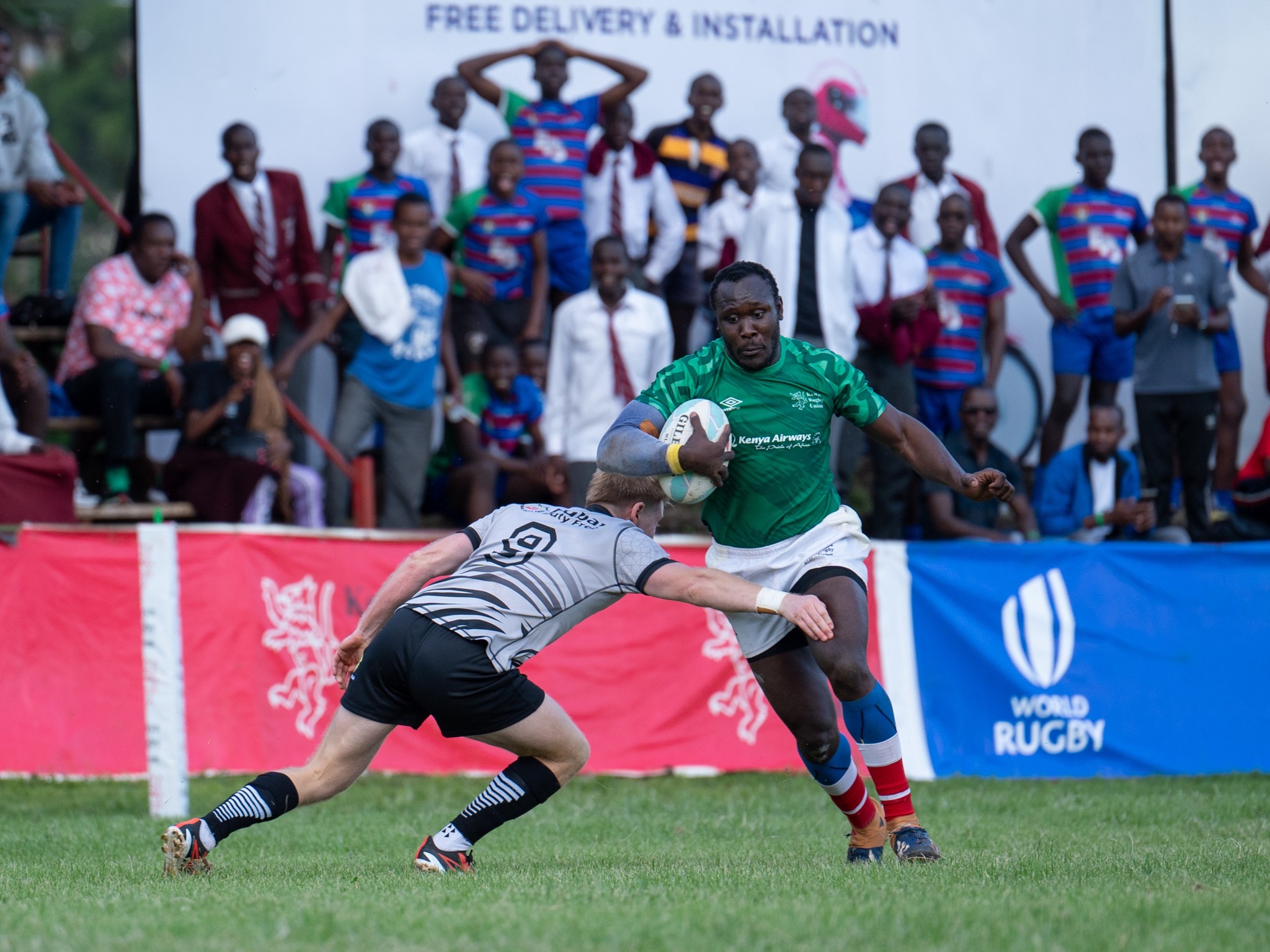 Kenya Simbas Elkeans Musonye powers his way past a UAE  player during their friendly match at the RFUEA ground/ HANDOUT