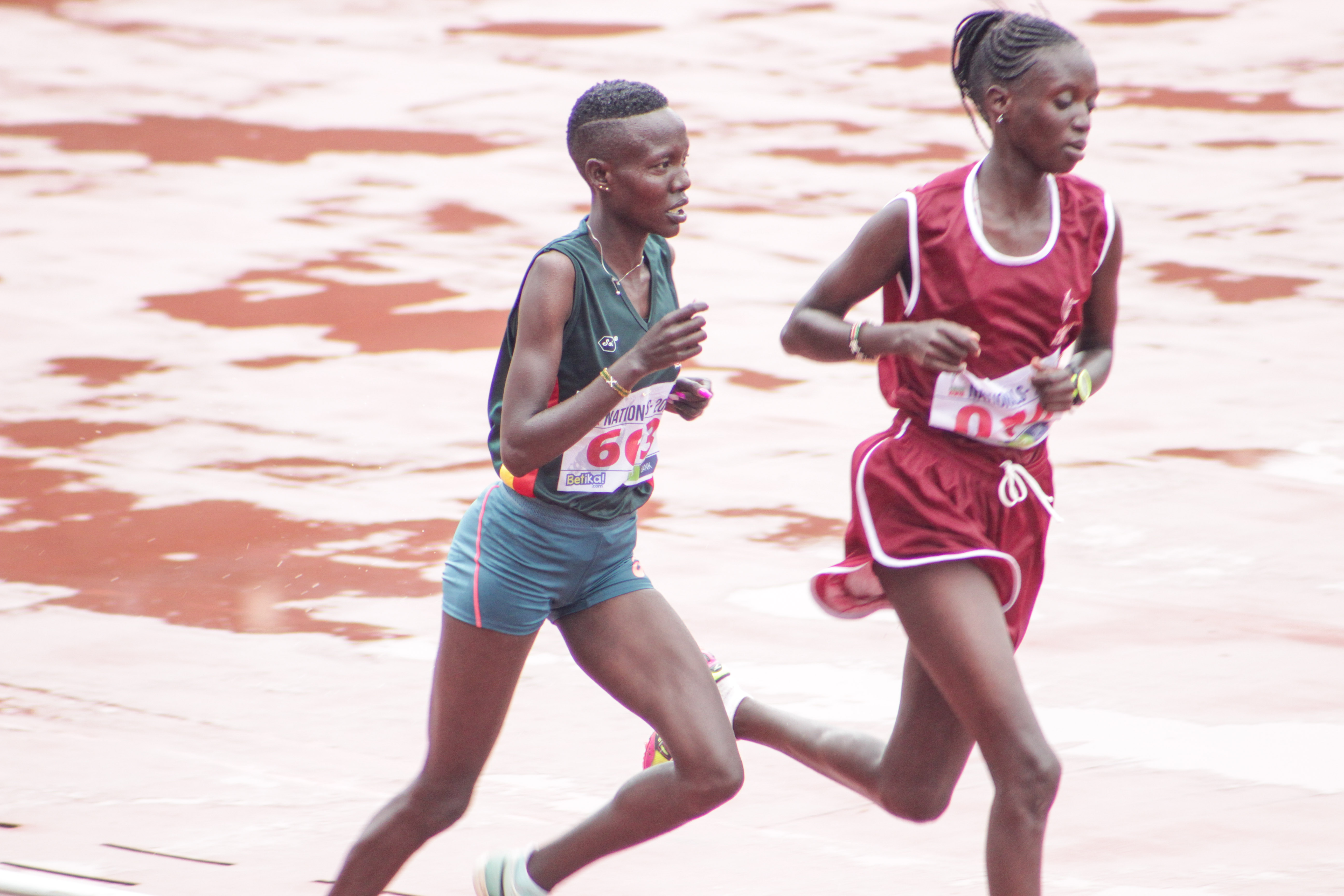 Loice Chemnung (L) competes in the women's 10,000m race/ TEDDY MULEI