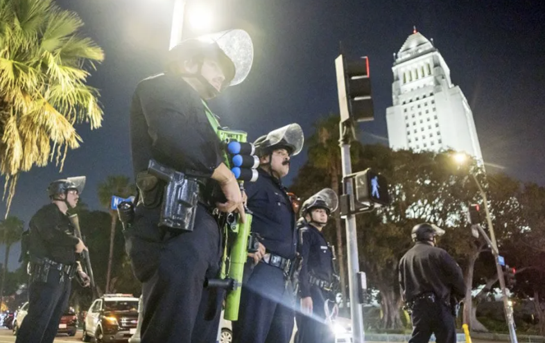 LA police enforce curfew as Trump vows to 'liberate' city