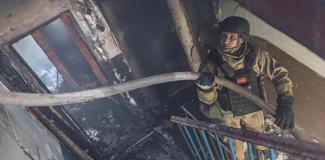 Buildings burn as another wave of Russian attacks hits Ukraine