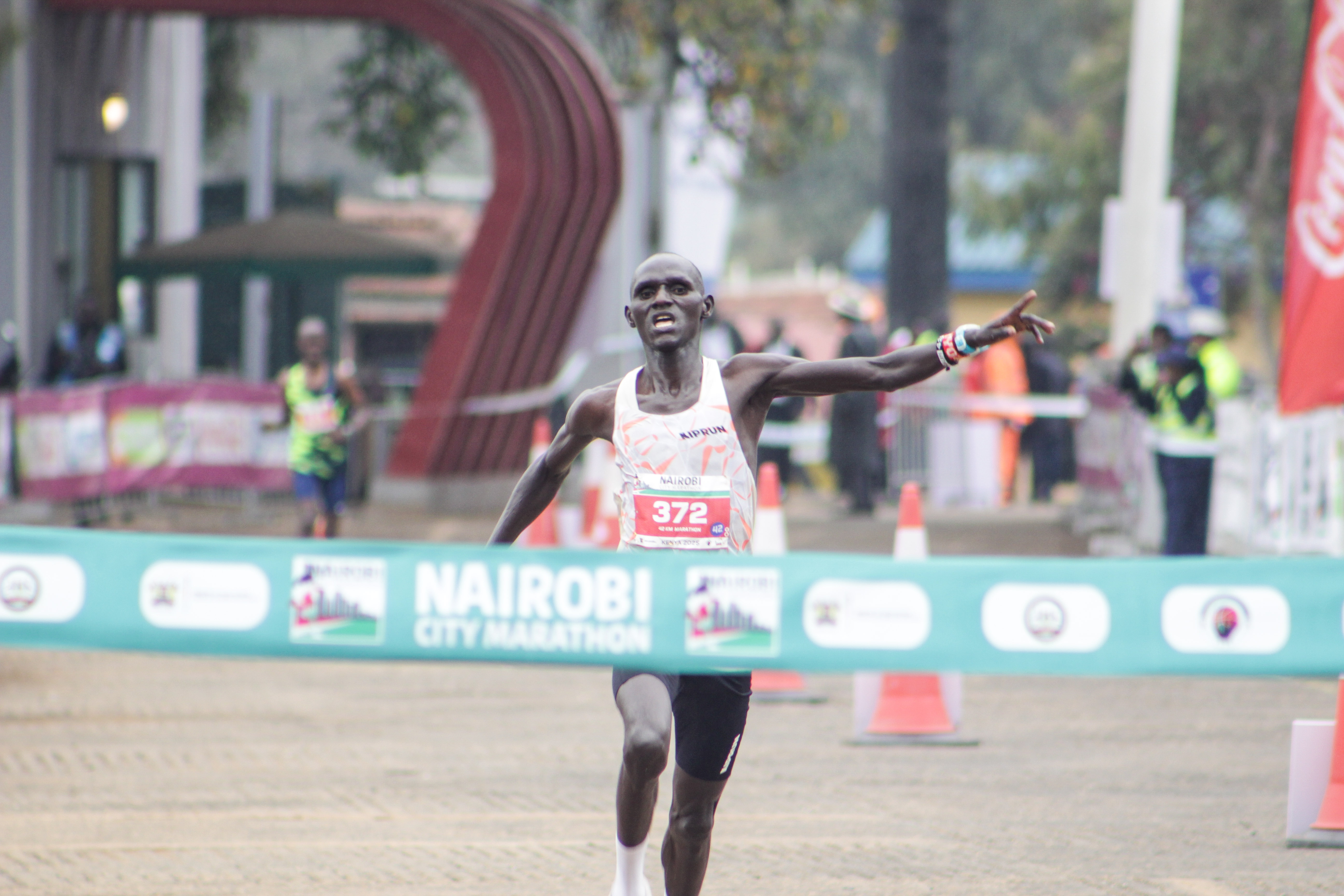 Benson Murkomen crosses the finish line to win the men's 42km race
