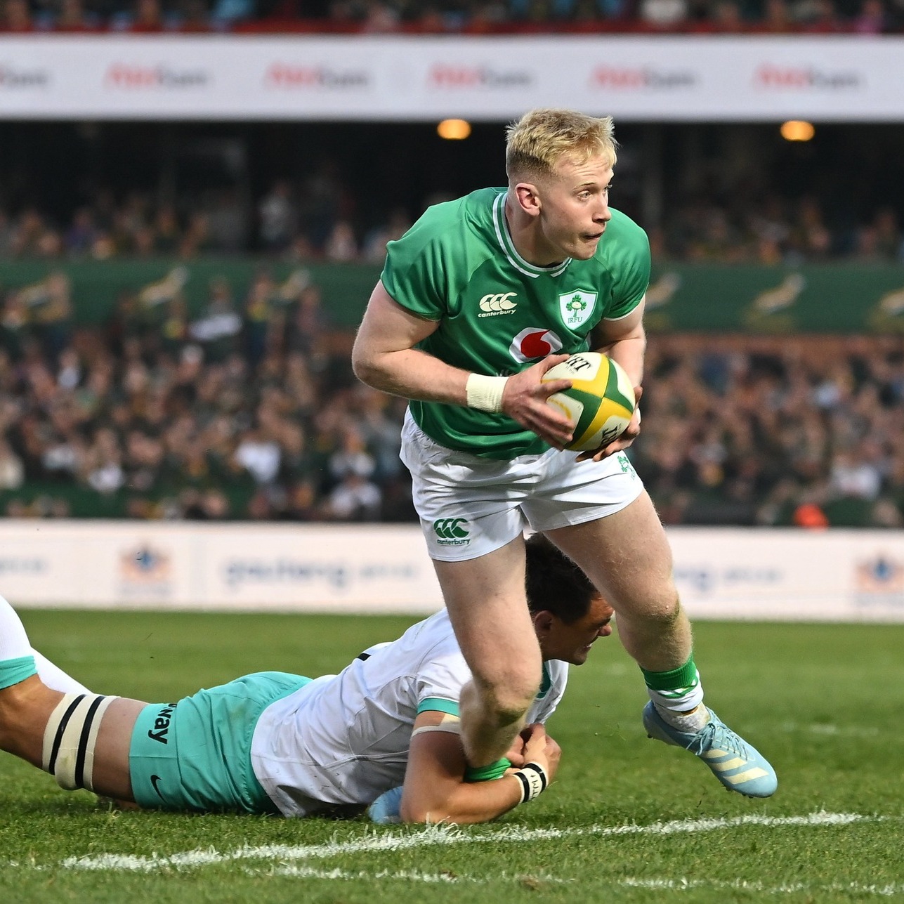 Jamie Osborne fends off atackle from South Africa during a recent match