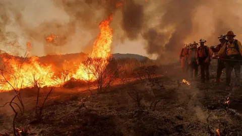 Rapidly growing fire prompts thousands of evacuations in California