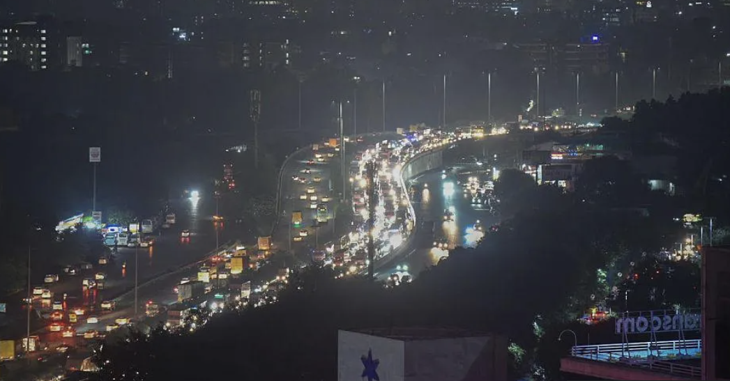 Eight-hour traffic jams in Delhi suburb as rains wreak havoc
