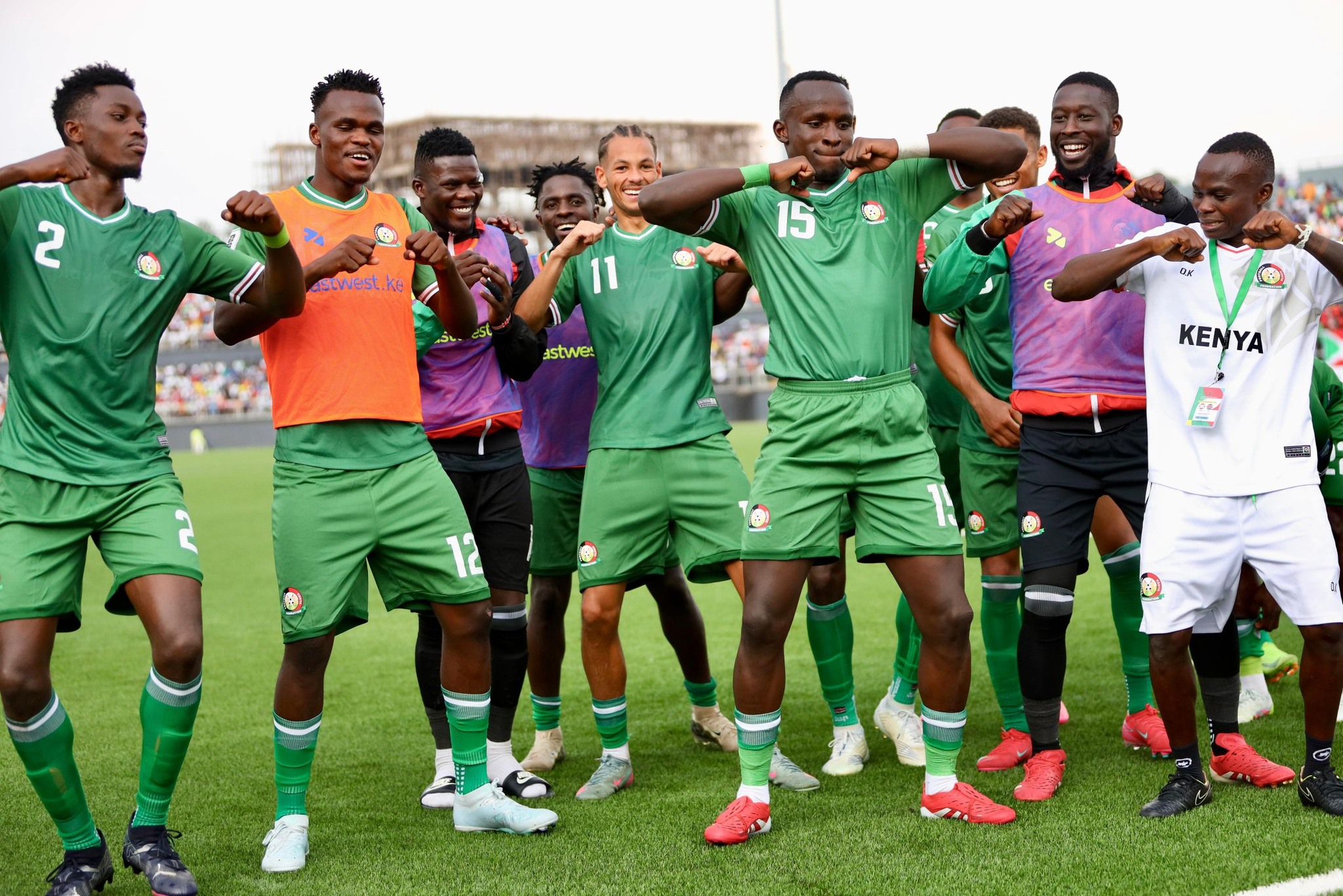 Harambee Stars' striker Ryan Ogam (15) leads the celebrations after scoring against Burundi