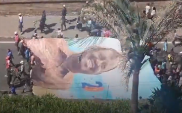 United in grief: Raila’s supporters carry giant banner through CBD