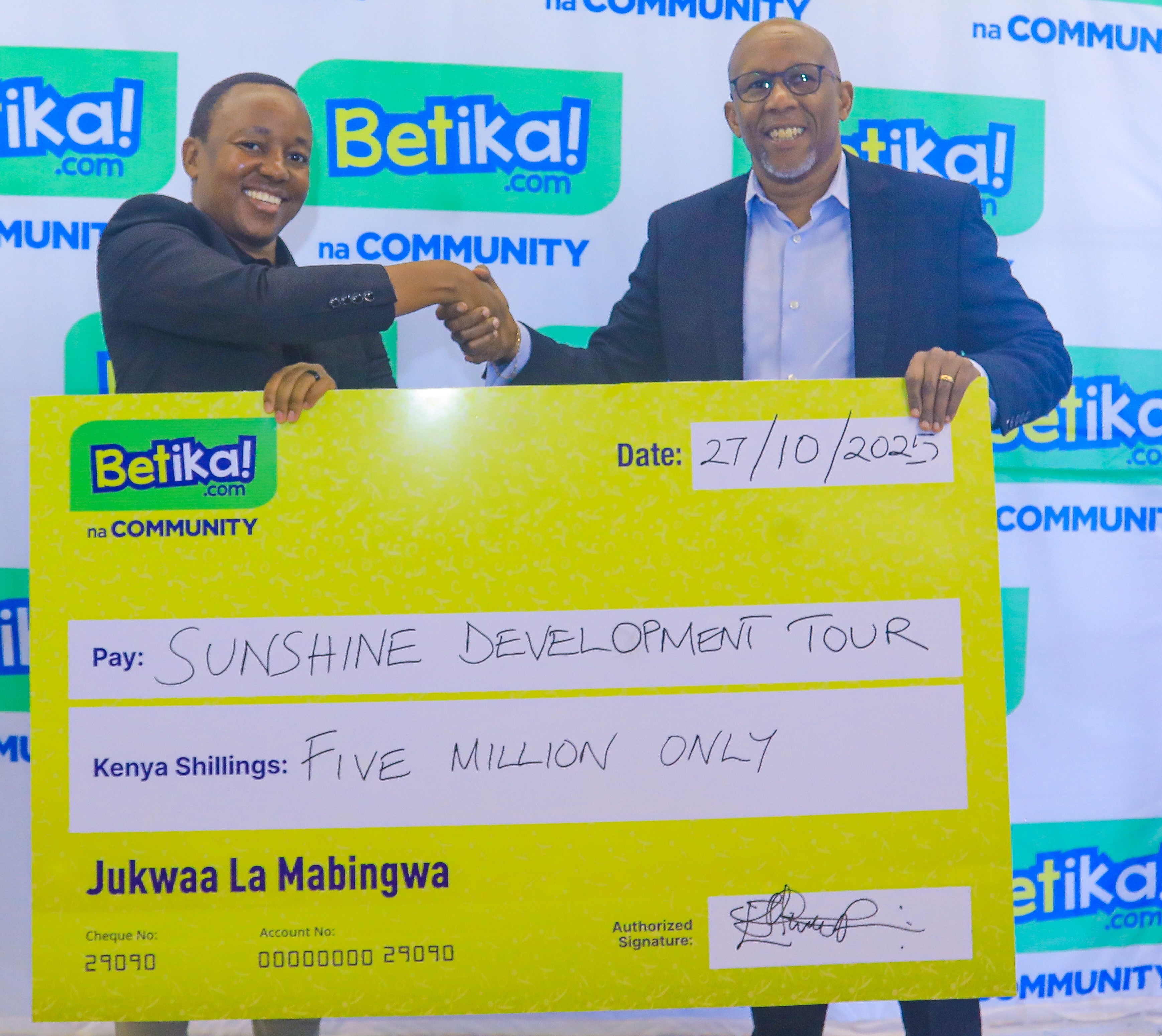 Betika Group Head of Brand Eric Mwiti with IMG Kenya CEO Peter Gacheru during the signing of the sponsorship agreement for the Betika Masters