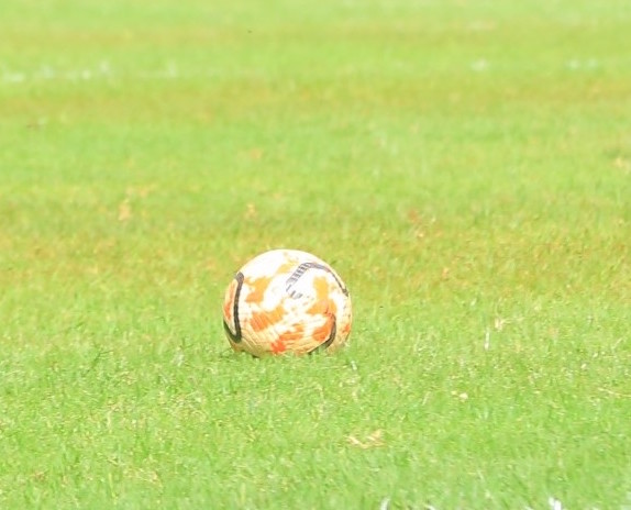A ball sits on the pitch during a recent match