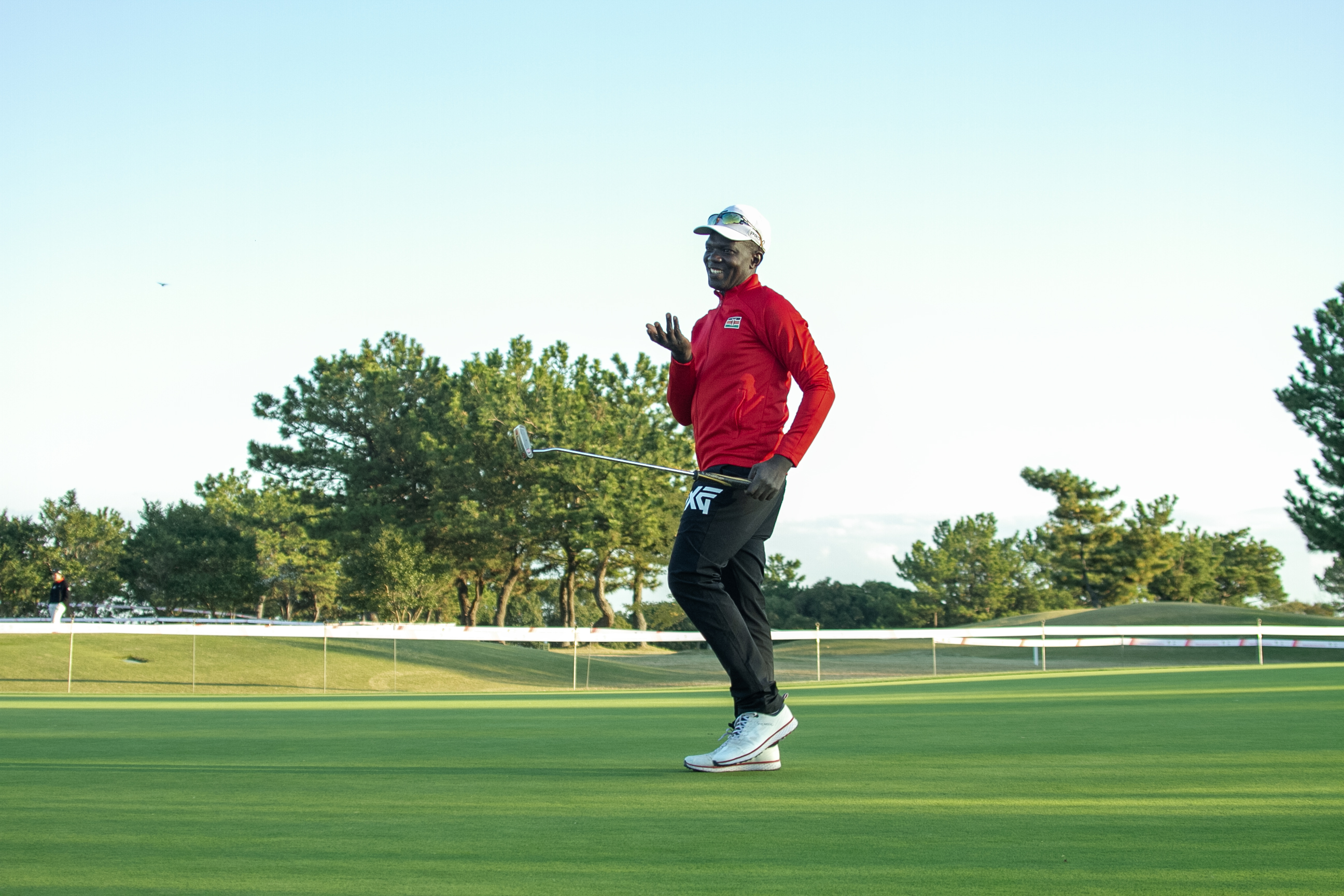 Golfer Isaac Makokha reacts during  the competition.