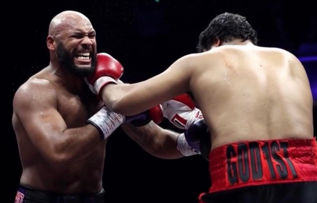 Jeamie 'TKV' Tshikeva (R) punches Frazer Clarke