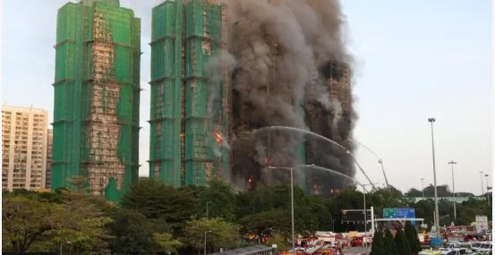 Four dead as fire engulfs Hong Kong buildings
