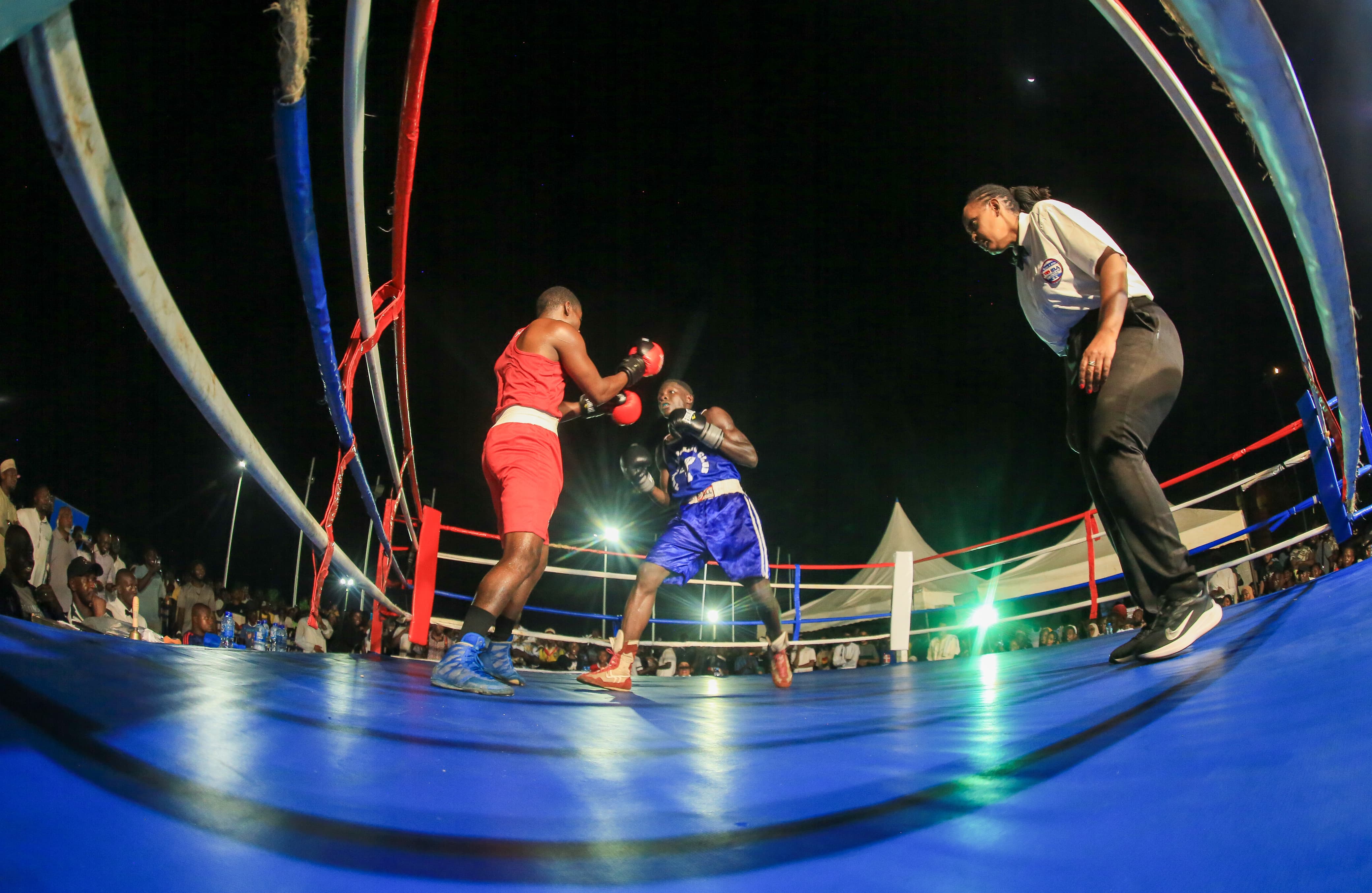 Kisauni’s Hamza Said and Nyali’s Francis Oduor square it out at the inaugral Pwani Boxing Festival at Mama Ngina Waterfront Park on Friday.