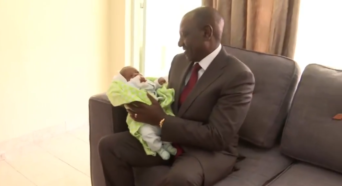 Ruto cradles newborn during visit to Embakasi police college