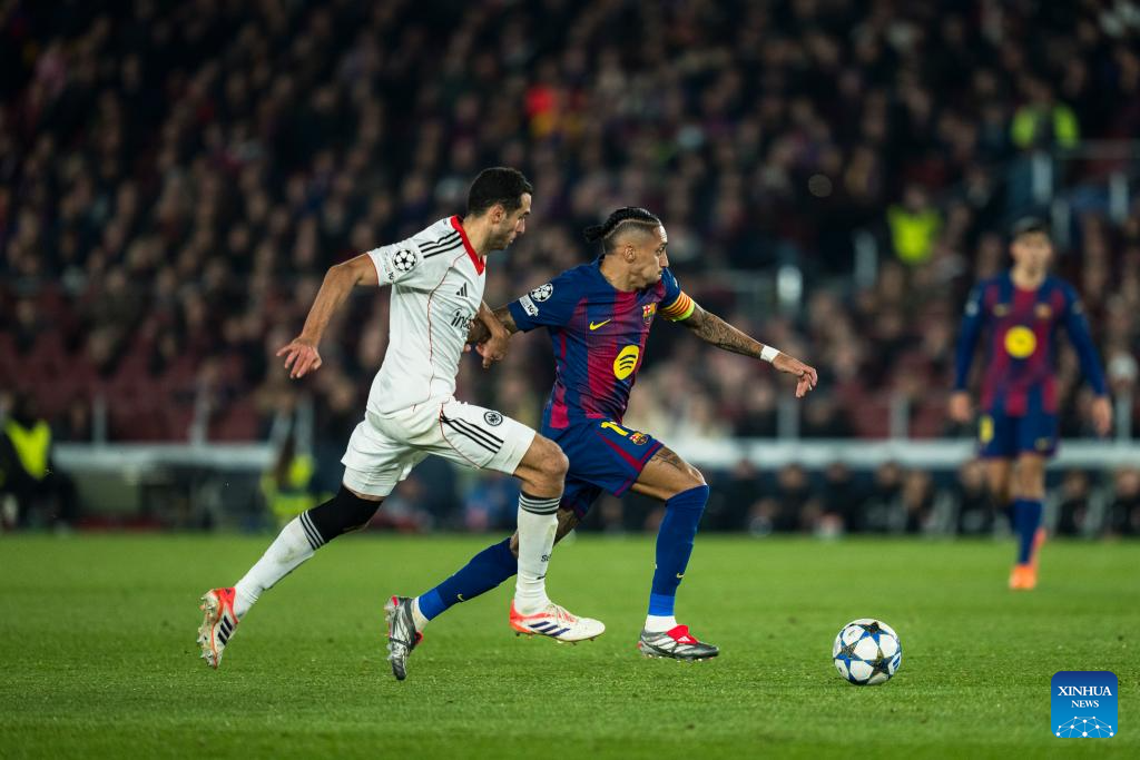 FC Barcelona's Raphinha (R, front) competes with Eintracht Frankfurt's Ellyes Skhiri during the UEFA Champions League football match between FC Barcelona and Eintracht Frankfurt in Barcelona, Spain, Dec. 9, 2025. (Photo by Joan Gosa/Xinhua)