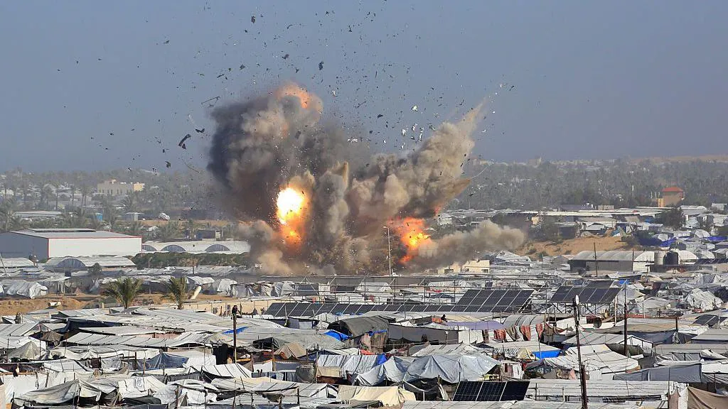 Israeli air strikes kill at least 27 Palestinians in Gaza, rescue officials say