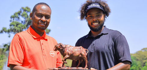 Peter Waweru, Absa Bank Kenya Head of Brand &amp; Consumer Marketing, presents a trophy to Njoroge Kibugu/HANDOUT