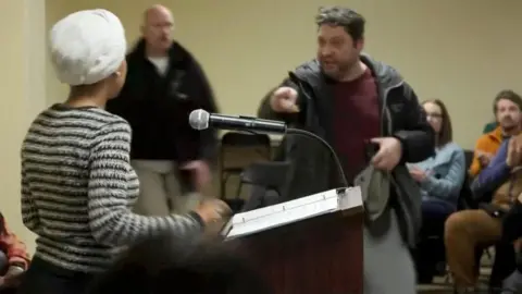 Congresswoman Ilhan Omar attacked with 'unknown liquid' during town hall