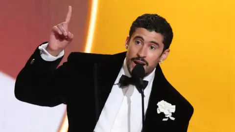 Bad Bunny makes Grammy history as stars protest against ICE