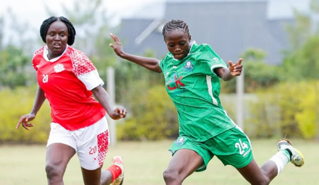 Kibera Soccer women's Pauline Ochieng (R) in action with Trinitys' Fabrish Ayako at Gilgil on Saturday/ HANDOUT