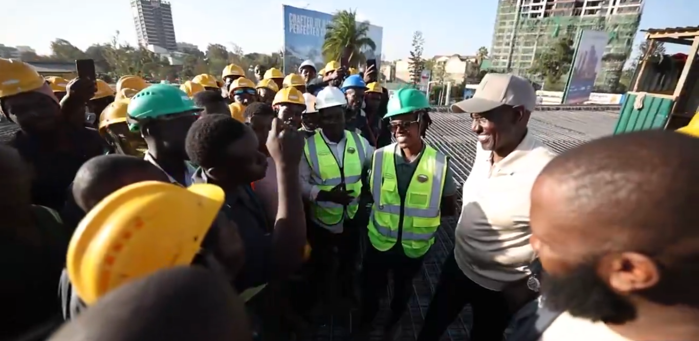 Ruto shares light moment with construction workers