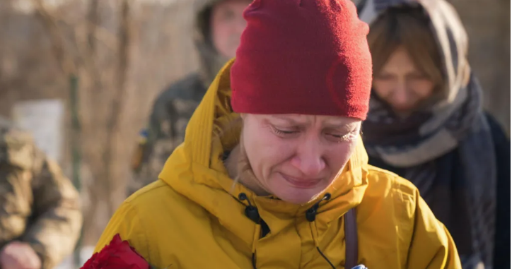 Fearing Russia will seize her town, war widow moves husband's grave to Kyiv