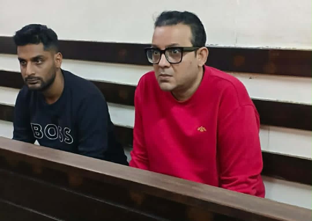 Two detained after denying charges of threatening to kill city trader