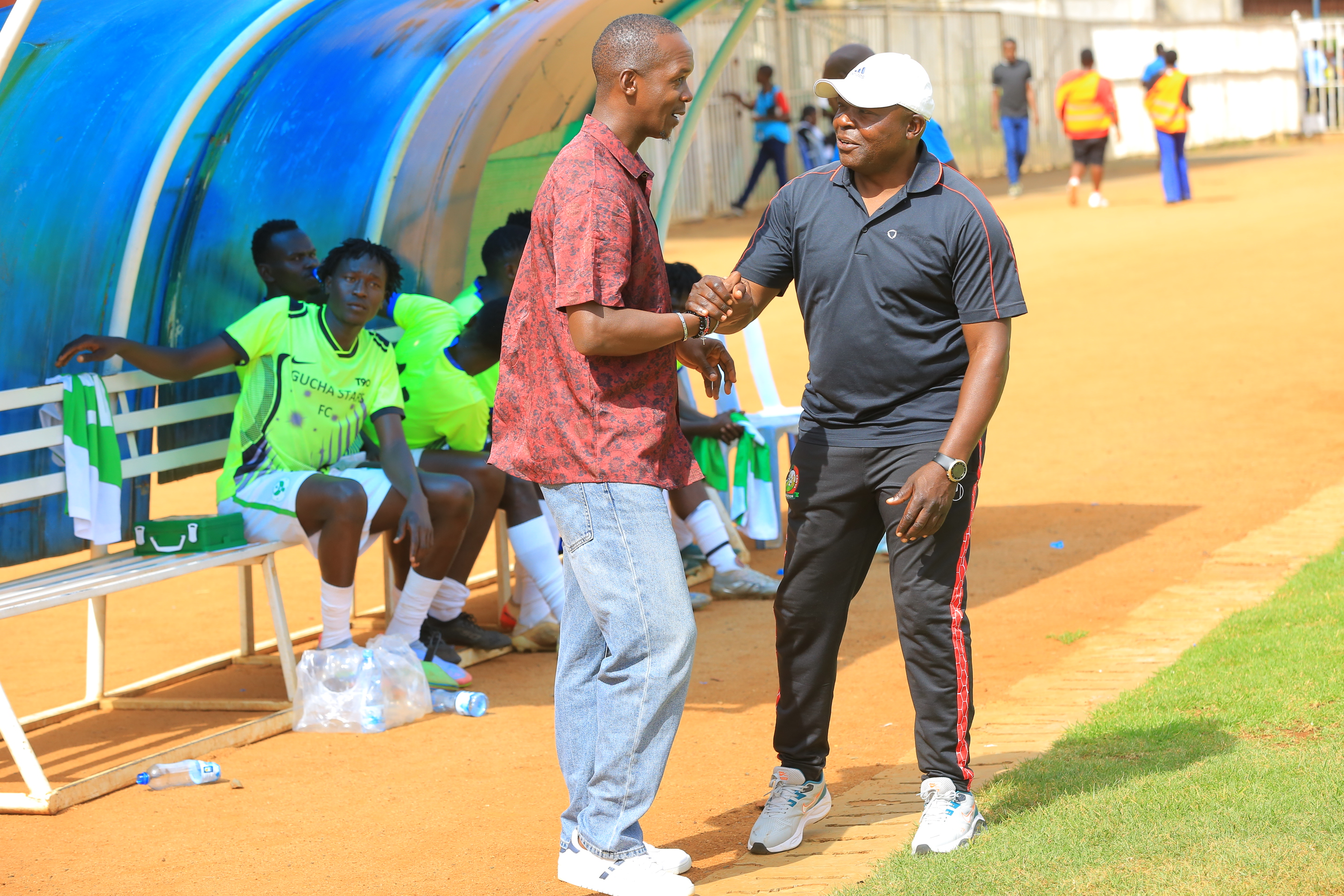 MOFA coach Charles Warinda with Gucha Stars' Sammy Okoth at Gusii Stadium