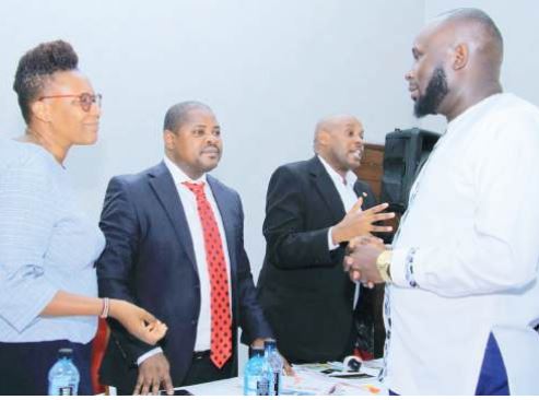 The Star commercial manager Ronald Ayieta talks with board members of the auctioneers’ association during their annual meeting in Machakos county /EZEKIEL AMING’A