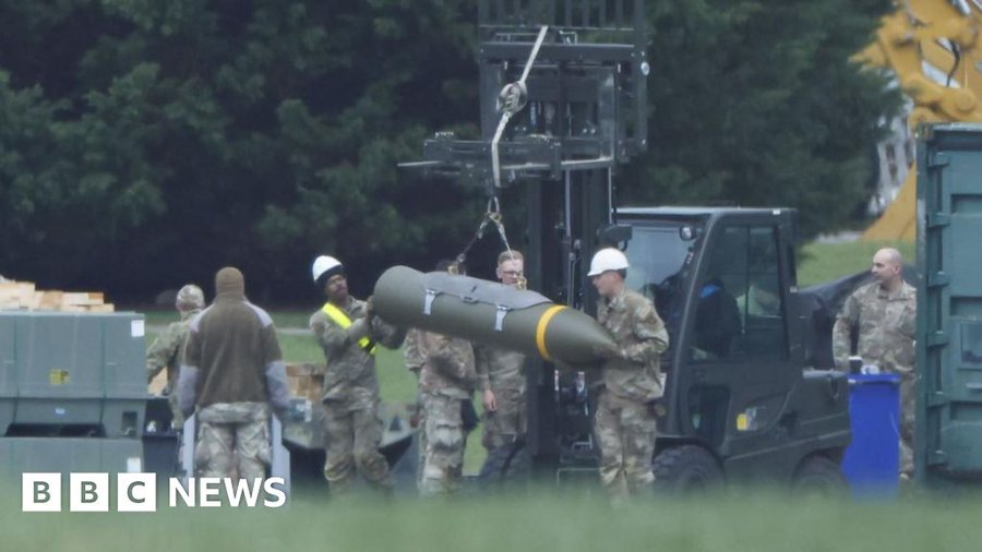 US military prepare explosive ordnance at UK air base
