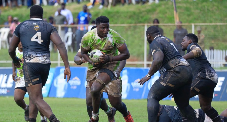 KCB  lock Andy Cole Omolo charges past the Pirates' defence during the Enterprise Cup quarters in Kampala on Saturday/HANDOUT