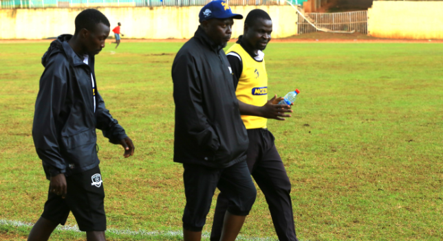 Coach Jeffers Odongo (C) with members of his technical bench at Gusii Stadium/ANGWENYI GICHANA
