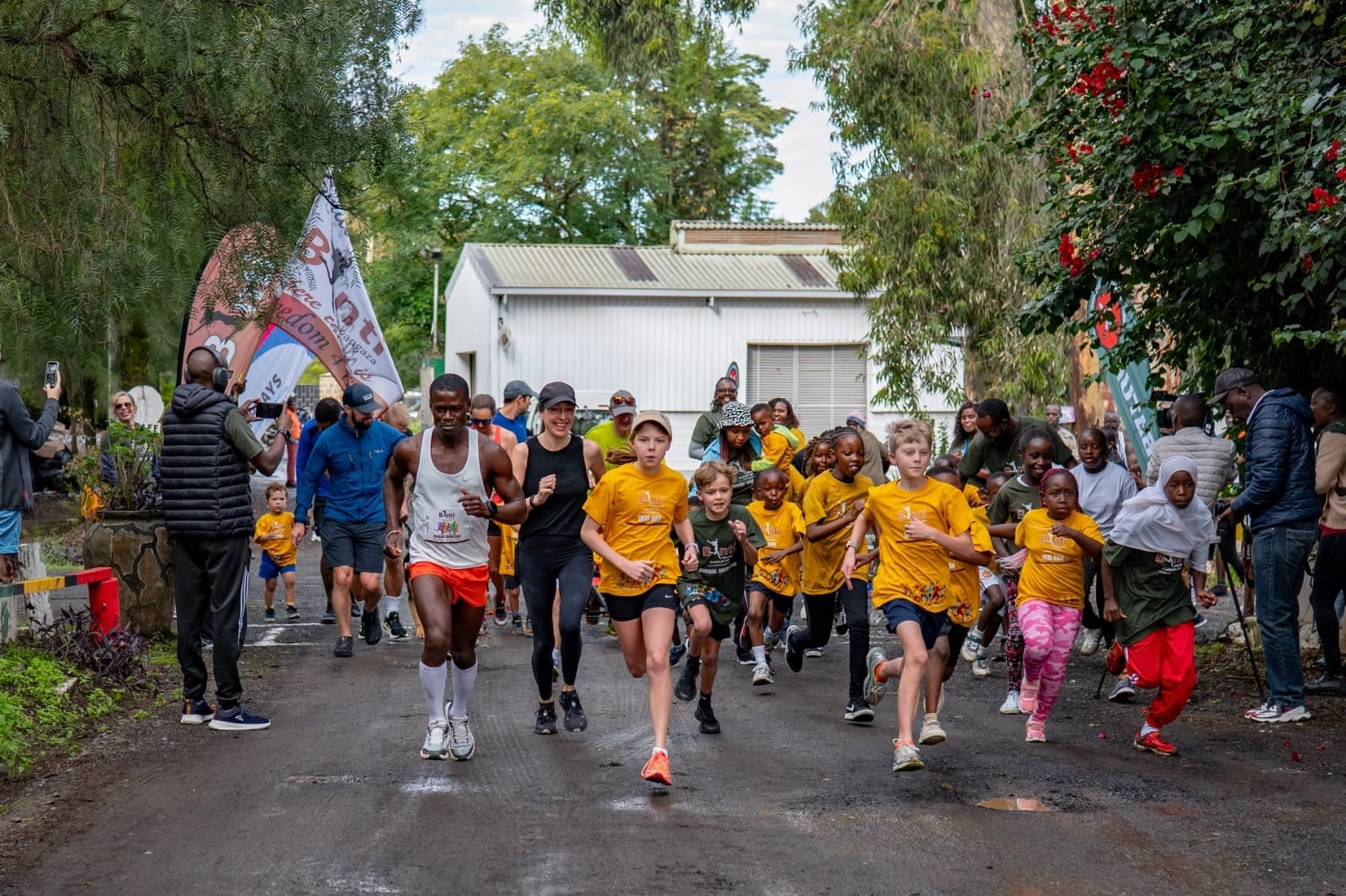 British soldier Isaac Debrah (left) leads other soldiers and their children in a 10-km race to raise awareness on menstrual hygiene/ ALICE WAITHERA