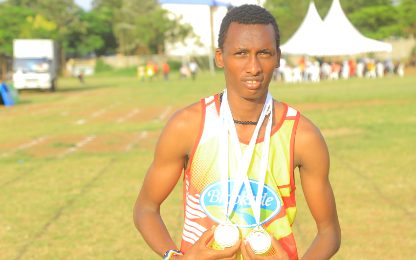 Alex Moonka of Riooga Secondary poses with his medals after winning the 100m and 200m  at the national secondary school games in Kisumu/ANGWENYI GICHANA